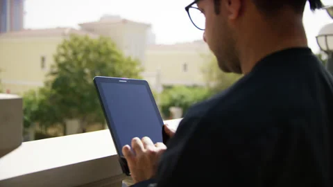 Omani man looking at his tablet. Stock Footage 152723867