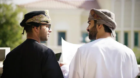 Omani men looking at blue prints. Stock Footage 152726963