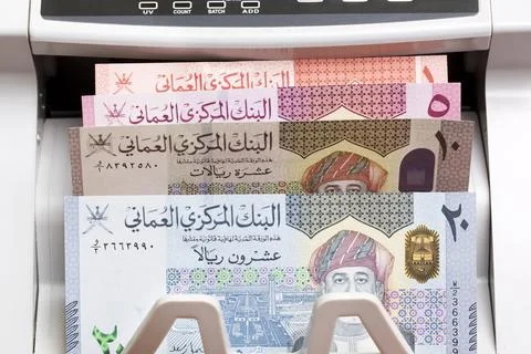 Omani rial in the counting machine Stock Photos