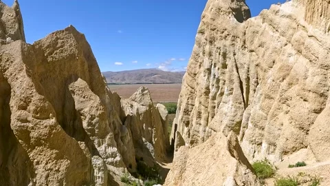 Omarama Clay Cliffs unique landscape with pinnacles, deep ravines, and shar.. Stock Footage 295011403