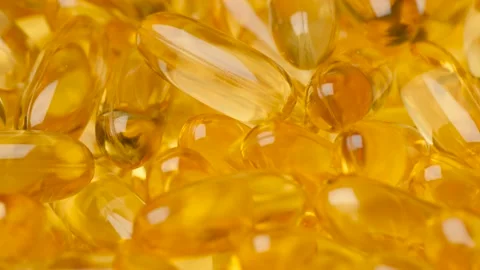 Omega-3 capsules. Camera slowly moves down and show few omega-3 capsules. Macro Stock-Footage 170142250