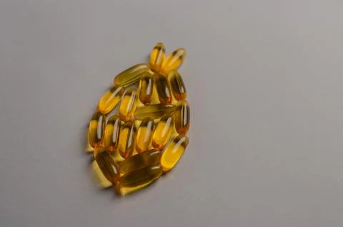 Omega 3 capsules - fish shape. Top view, copy space, high resolution product Stock Photos