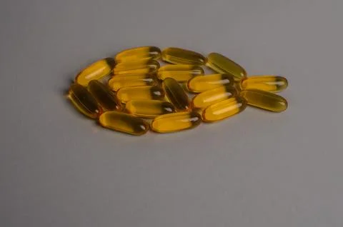 Omega 3 capsules - fish shape. Top view, copy space, high resolution product Stock Photos