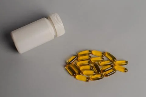 Omega 3 capsules - fish shape. Top view, copy space, high resolution product Stock Photos