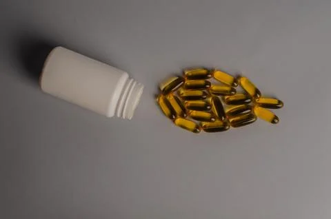 Omega 3 capsules - fish shape. Top view, copy space, high resolution product Stock Photos
