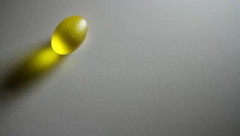 Omega 3 capsules rolling Stock Footage 10901925