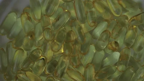 Omega 3 capsules, rotate smoothly Stock Footage 130633800