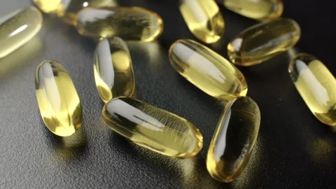 Omega 3 Capsules on a Rotating Platform Video stock 332367452