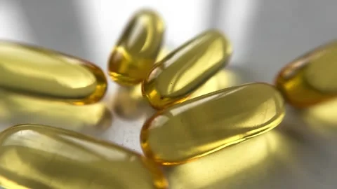 Omega 3 capsules on a white background with white light near the window. Stock Footage 265696322