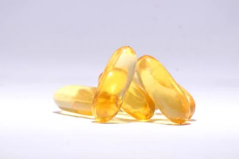 Omega 3 fish oil capsule with white background  Stock Photos