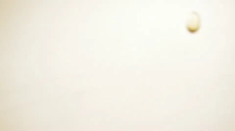 Omega-3 pills fall to the white surface. Stock Footage 22256182
