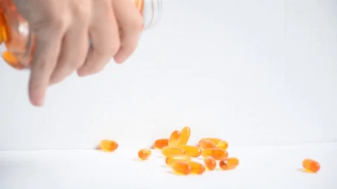 Omega 3 pills on surface Stock Footage 129767732