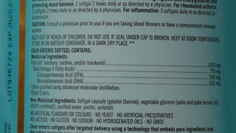 Omega 3 supplement packaging overview and nutritional information details Stock Footage 303555953
