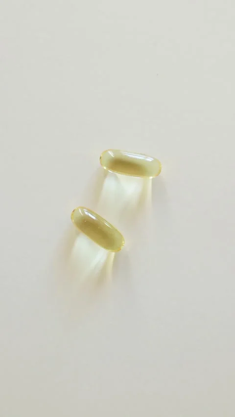 Omega 3 vitamin D cod liver oil healthcare. Natural supplement close-up Stock Footage 274879356