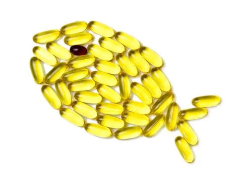 Omega3 Capsules in Fish Shape. Isolated on White. Stock Photos