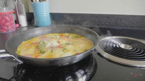 Omelet cooking in a skillet with extraction system Stock Footage 114553089