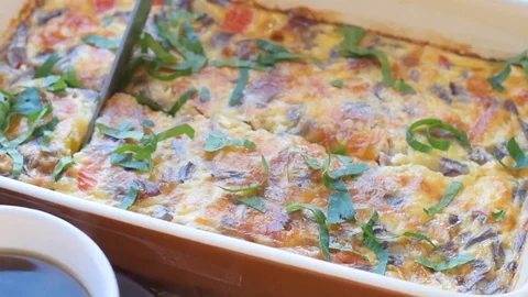 Omelet with ham and cheese in a baking form. Breakfast. 動画素材 70415285