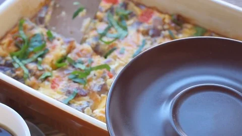 Omelet with ham and cheese in a baking form. Breakfast. Stock Footage 70415357