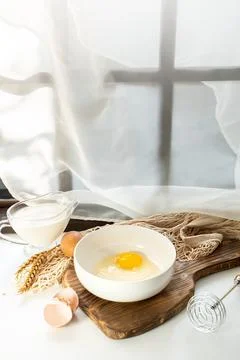 Omelet making process, ingredients, eggs and milk on the table Stock Photos
