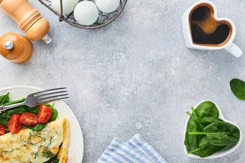 Omelet or omelette with spinach, cherry tomato and pepper seasoning on a whit Stock Photos