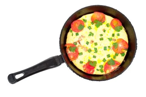 Omelet pan with tomatoes Stock Photos