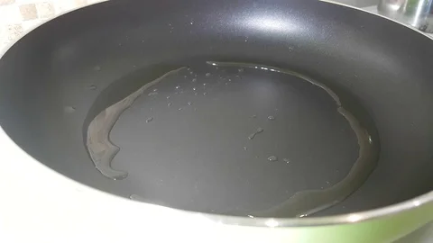 The omelet is poured into the pan Stock Footage 81067540