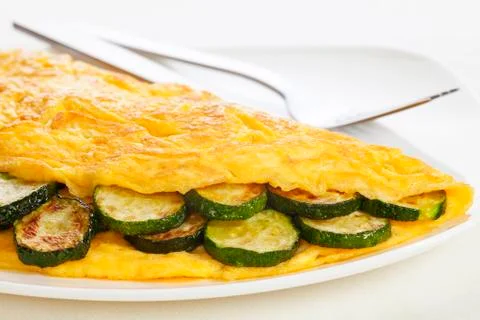 Omelet with zucchini Stock Photos