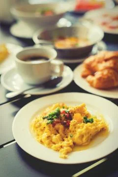 Omelets, breakfast served with coffee and croissants. Stock Photos