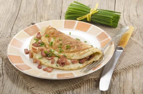 Omelette with bacon and chive Stock Photos