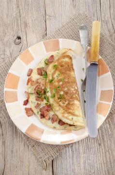 Omelette with bacon and chive Stock Photos