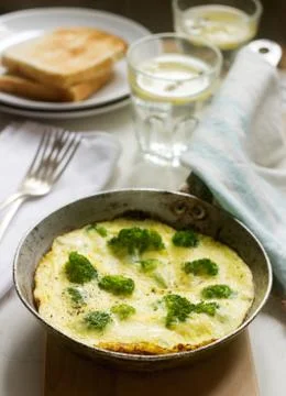 Omelette with broccoli and cheese served with bread toasts and lemonade. Stock-Fotos