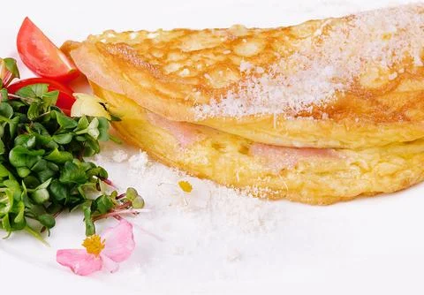 Omelette with ham cherry tomatoes on plate Stock Photos