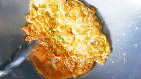 Omelette in the pan Stock Footage 89390621