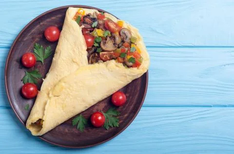 Omelette stuffed with vegetables Stock Photos