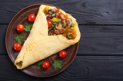 Omelette stuffed with vegetables Stock Photos