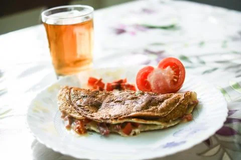 Omelette , tea and tomato, Breakfast Stock Photos