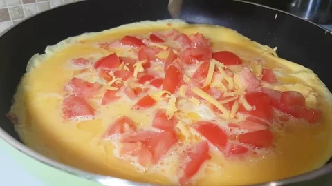 Omelette with tomato and cheese Stock Footage 81070853