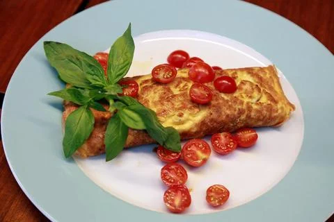 Omelette with tomatoes and vegetable Stock Photos
