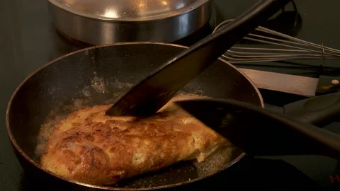 Omelette turned on stove top 動画素材 130797466