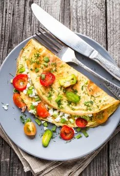 Omelette with vegetables Stock Photos
