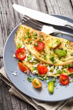 Omelette with vegetables Stock Photos