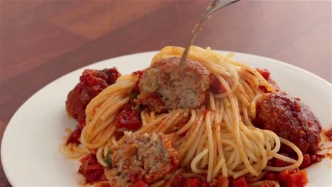 Omeone hand with fork meatballs with spaghetti and tomato sauce close up Stock Footage 112662046