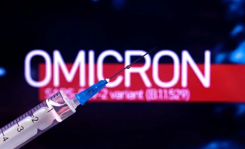 Omicron coronavirus variant. World epidemic background with syringe close-up, Stock Photos