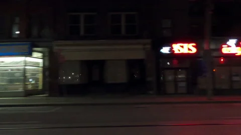 OMICRON covid 19 Toronto lockdown closes retail stores POV side view night Stock Footage 168286144