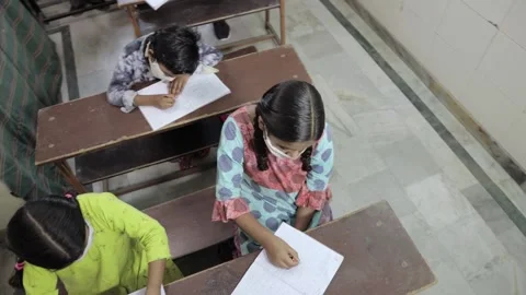 Omicron, Indian Students Studying In Classroom Wearing Mask, Top Angle Stock Footage 138138594