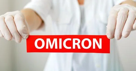 Omicron red warning sign with text new Omicron variant covid 19 in doctor hands Stock Photos