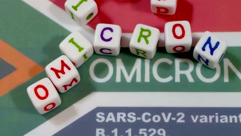 Omicron text on plastic beads, Concept of new SARS COV2 v Video stock 172450993