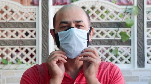 Omicron virus Double mask prevent infection,  indian man wearing two face mask Video stock 152920947