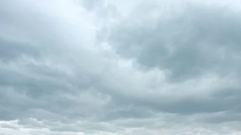 Ominous clouds drift slowly across the sky, threatening rain. 4k video Stock Footage 72099916