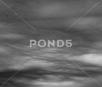 Ominous clouds as if armageddon. The grey storm clouds over horizon. Stock Photos